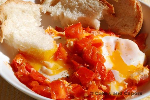 Eggs in tomato with crusty bread